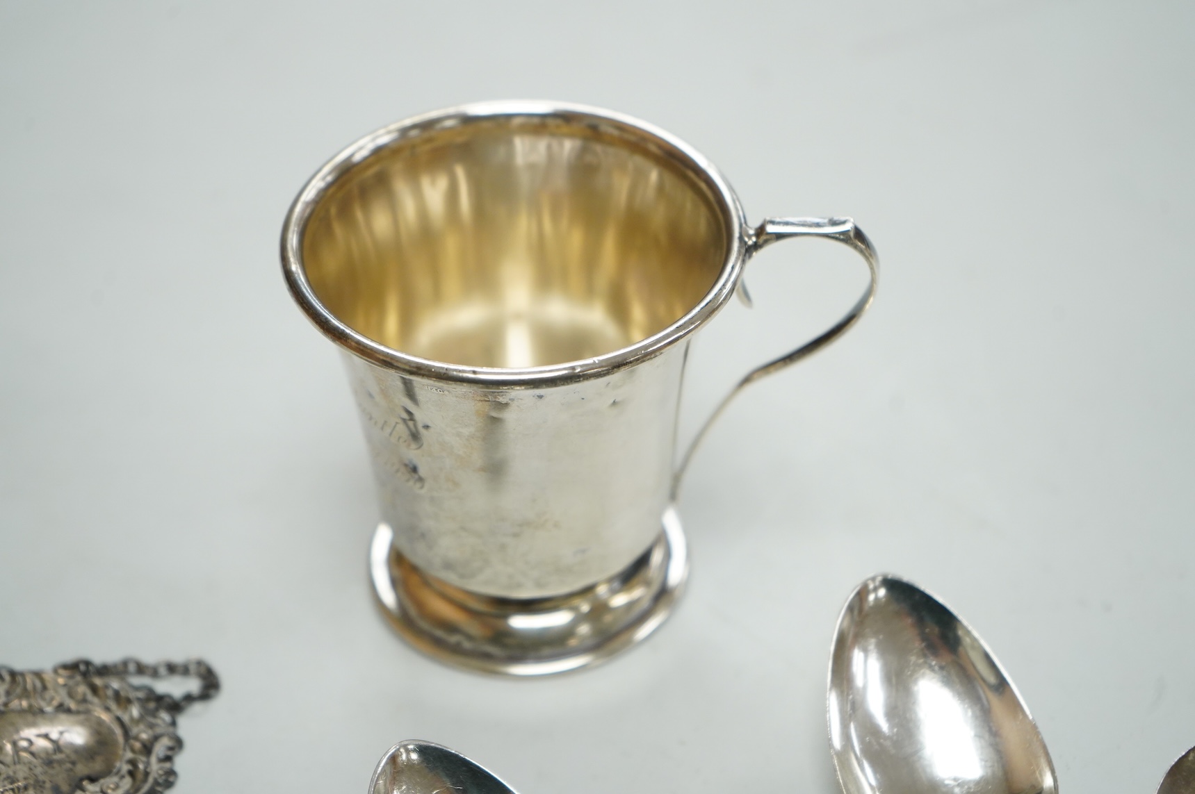 A collection of silver to include a set of six George IV silver Kings pattern teaspoons, by William Eaton, London 1824/5, five other items of silver flatware, a small trophy cup, christening mug and wine label, 13oz.